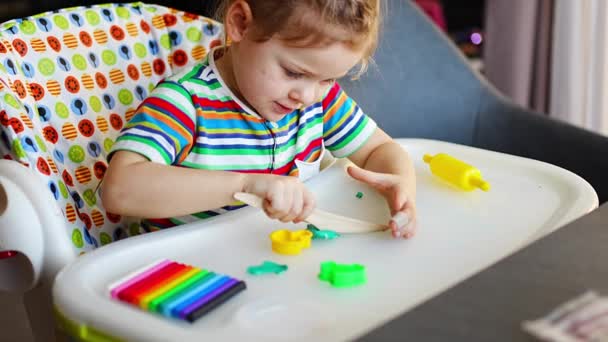Little Girl Plays Multi Colored Plasticine Creates Different Shapes Wooden — Vídeos de Stock