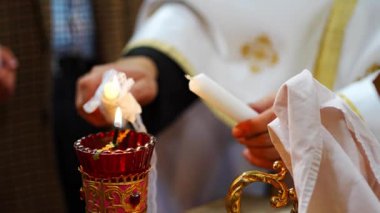 Prague, Czech Republic - February 2, 2023: Priest conducts the christening ceremony in church Cathedral of St. Clement in Prague, Czech republic. High quality 4k footage