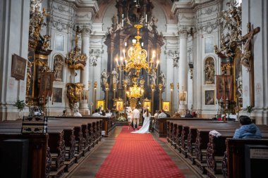 Prague, Czech republic - October 8, 2022: Interior of church Cathedral of St. Clement. Ceremony with Icons in the interior of church. High quality photo