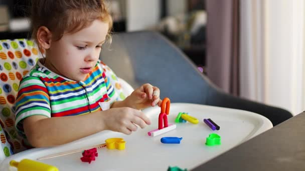 Little Girl Plays Multi Colored Plasticine Creates Different Shapes High — Vídeos de Stock