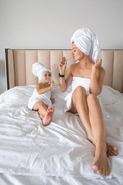 Happy Family Mother Little Daughter Dressing Gowns Towels Laugh Drinking — Stock Photo, Image