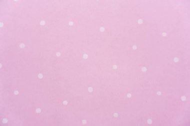 Pembe arka planda beyaz benekli nokta. Kağıt deseni. Yüksek kalite fotoğraf
