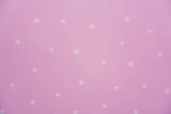 ピンクの背景に白いポルカのドット ペーパーパターン 高品質の写真 — ストック写真
