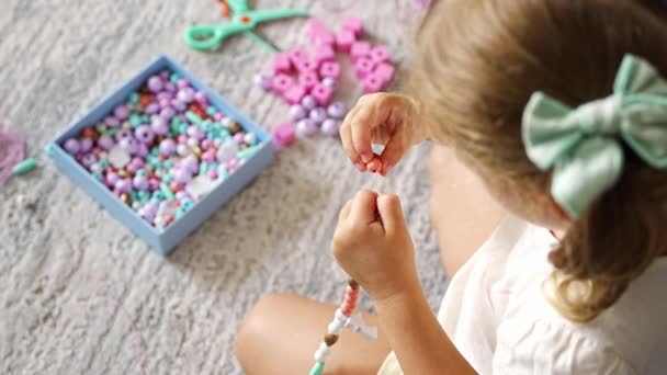 Little Girl Making Wooden Beads Bracelet Home Living Room Childrens — Stock Video