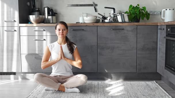 Young Woman Sitting Doing Meditation Background Dirty Dishes Kitchen Slowdown — Stock Video