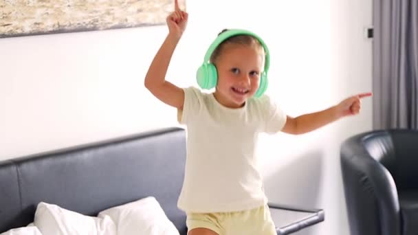 Little Girl Enjoying Music Kids Headphones Dancing Home Happy Morning — Stockvideo
