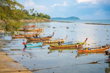 Rawai, Thailand - December 12, 2023: Fishing boats at Rawai beach after day work in Thailand. High quality photo