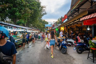 Phuket, Thailand - December 19, 2023: Trade in seafood at the market in Rawai, tourists buy seafood at the seafood market. High quality photo