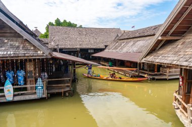 Pattaya, Thailand - December 29, 2023: Floating open air market with small houses - shops on the pond in Pattaya, Thailand. High quality photo