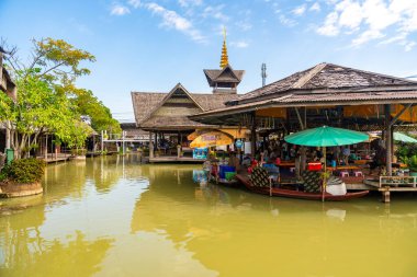 Pattaya, Thailand - December 29, 2023: Floating open air market with small houses - shops on the pond in Pattaya, Thailand. High quality photo
