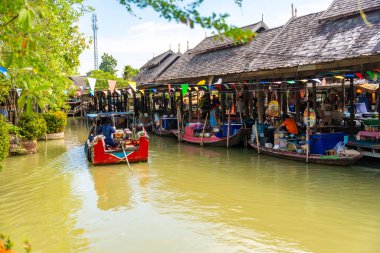 Pattaya, Thailand - December 29, 2023: Floating open air market with small houses - shops on the pond in Pattaya, Thailand. High quality photo