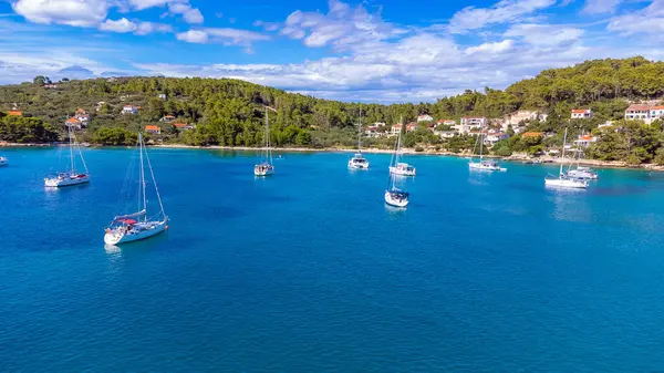 Stock image Drone view of yachts moored on buoys near the shore in the bay of Uvala Gradina near the town of Vela Luka on the island of Korcula in Croatia. 