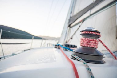 Yacht sailing in Adriatic sea. Close-up view of the deck, mast and sails. Yachting concept. High quality photo clipart