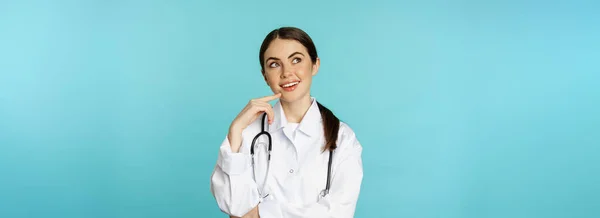 Young Female Doctor Hospital Worker White Coat Thinking Looking Away — Foto de Stock