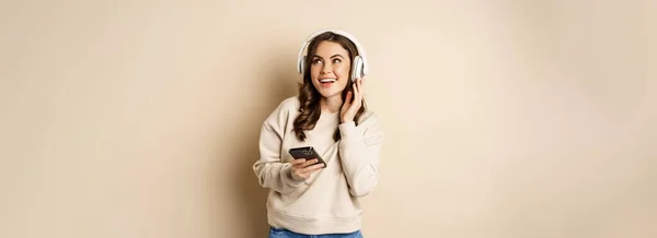 Happy Caucasian Woman Listening Music Headphones Smartphone App Dancing Having — стоковое фото
