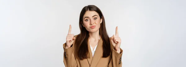 Hesitant Businesswoman Grimacing Sulking Pointing Fingers Disappointed Face Standing Suit — Stockfoto