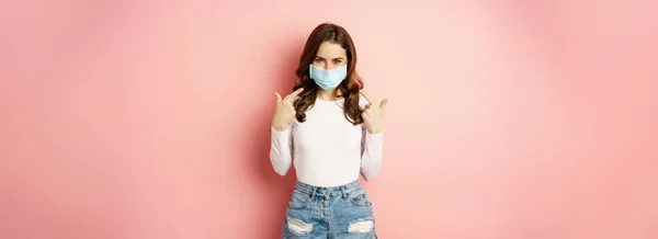 Portrait Young Stylish Woman Wearing Pointing Fingers Her Medical Face —  Fotos de Stock