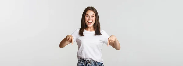 Satisfied Smiling Brunette Girl Pointing Fingers Recommend Product — Stock Photo, Image