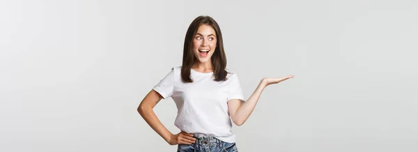 Excited Beautiful Girl Extend Arm Holding Something Hand Looking Happy — Stock Photo, Image