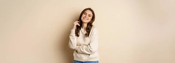 Beautiful Young Brunette Woman Posing Happy Beige Background Smiling Camera — Foto de Stock