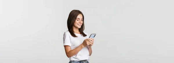 Beautiful Smiling Girl Using Mobile Phone Looking Smartphone Pleased — Stock Photo, Image