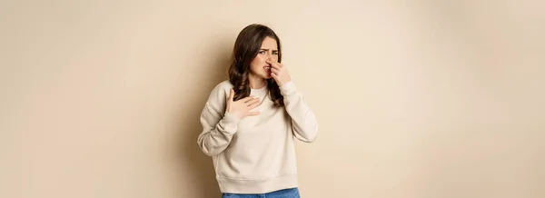 Woman Expressing Disgust Bad Disgusting Smell Close Nose Grimaing Dislike — Fotografia de Stock