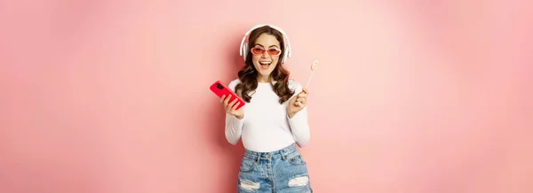 Stylish Summer Girl Dancing Smartphone Lolipop Listening Music Headphones Standing —  Fotos de Stock