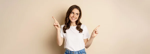 Happy Authentic Girl Smiling Pointing Fingers Sideways Showing Left Right — 图库照片