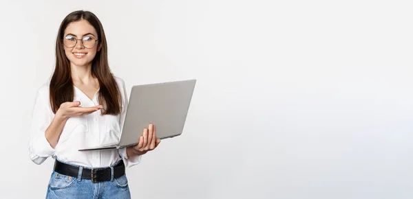 Portrait Woman Glasses Holding Laptop Pointing Screen Showing Her Work — 图库照片