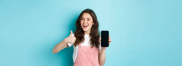 Yes Good Smiling Cute Girl Showing Thumb Empty Smartphone Screen — Stock Photo, Image