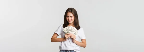Greedy Smiling Girl Looking Cunning Holding Money Standing White Background — Stock Photo, Image