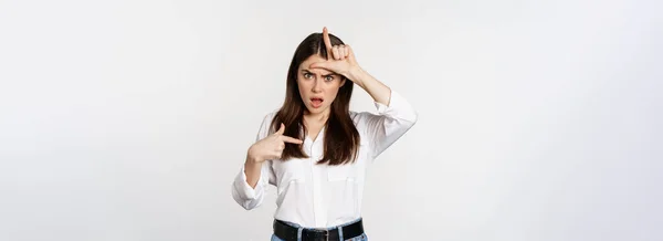 Insulted Woman Showing Loser Word Sign Forehead Pointing Herself Frustrated — Stok fotoğraf