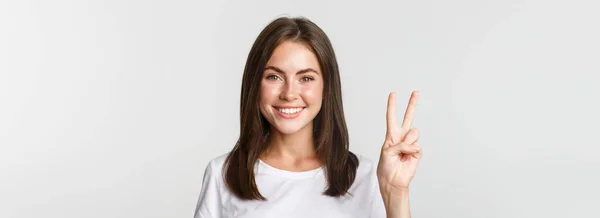 Portrait Beautiful Happy Brunette Girl Smiling Showing Peace Gesture Standing — Stock Photo, Image
