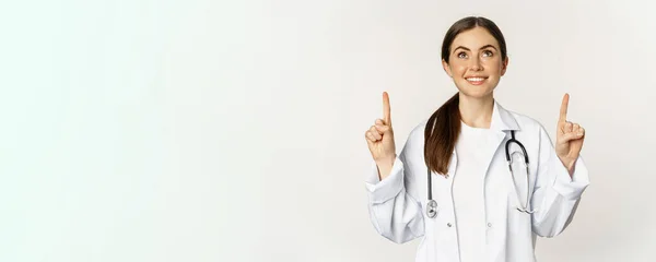 Happy Beautiful Doctor Female Physician Pointing Fingers Showing Advertisement Standing — Stok fotoğraf