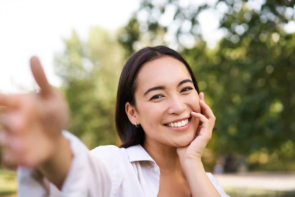 Smiling Asian Girl Takes Selfie Video Chats Holds Smartphone Speaks — Stock Photo, Image