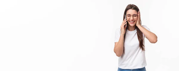 stock image Communication, technology and lifestyle concept. Portrait of excited and happy, overwhelmed young caucasian woman receive excellent news, smiling and laughing, talking on mobile phone.