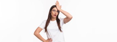 Girl realised she made dumb mistake. Bothered forgetful young caucasian woman punch forehead and sighing, looking gloomy as remember something important she forgot, white background.