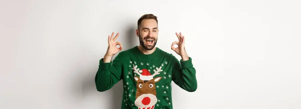 Christmas Holidays Celebration Happy Young Man Green Sweater Winking Showing — Stock Photo, Image