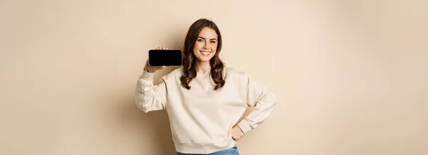 Portrait Smiling Cute Woman Showing Horizontal Smartphone Screen Website Application — Foto Stock