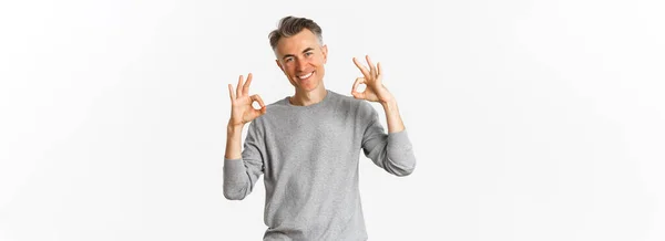 Portrait Successful Handsome Man Grey Sweater Showing Okay Signs Smiling — Stock Photo, Image