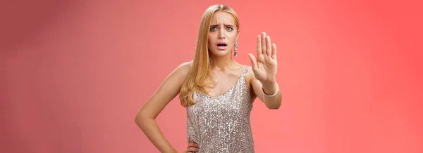 Freaked Out Displeased Bothered Insecure Blond Woman Silver Glittering Dress — 스톡 사진
