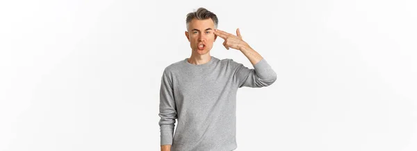 Image Annoyed Fed Middle Aged Man Showing Finger Gun Sign — kuvapankkivalokuva