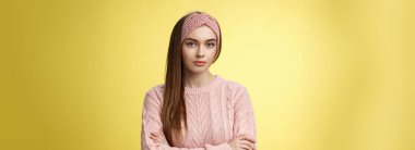 Serious-looking bossy focused intense young female office worker cross arms over chest in defensive confident pose, being displeased, dissatisfied and pissed with inappropriate employee behaviour.