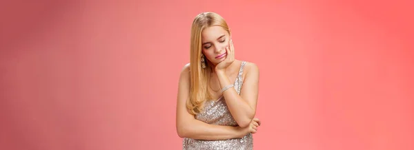 Bored sleepy party girl blond hairstyle in silver evening dress tired nightclub lean head palm sleeping fall asleep standing exhausted need energy caffeine wanna return home lean bad, red background.