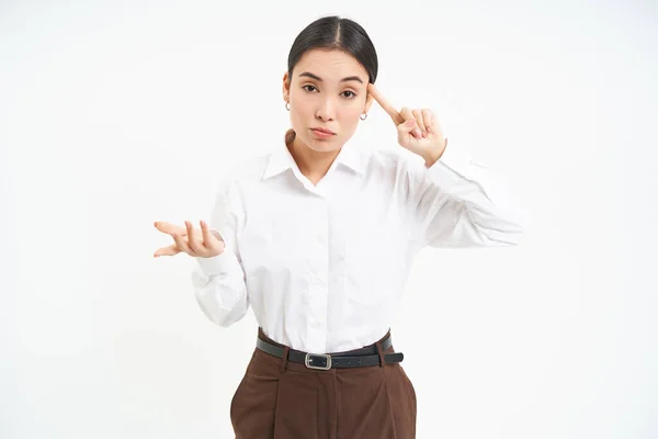 Corporate Woman Looks Annoyed Points Finger Head Mocks Someone Scolding — Stock Photo, Image