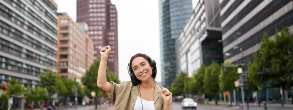 Portrait Smiling Asian Woman Dancing Triumphing Feeling Happy While Listening — Stock Photo, Image
