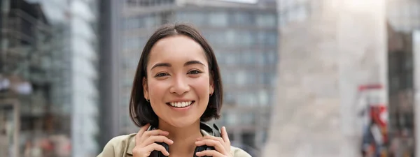 Vertical Shot Beautiful Asian Woman Posing Headphones Neck Smiling Laughing — Stock Photo, Image