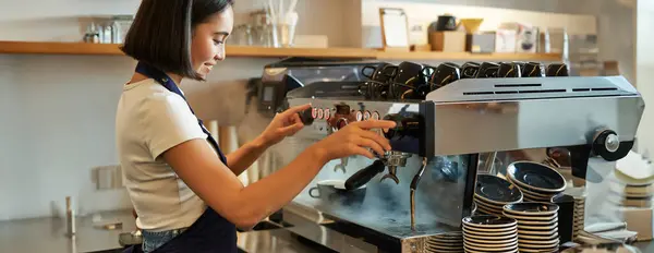 Smiling Cute Korean Girl Barista Working Coffee Machine Prepare Cappuccino Royalty Free Stock Photos