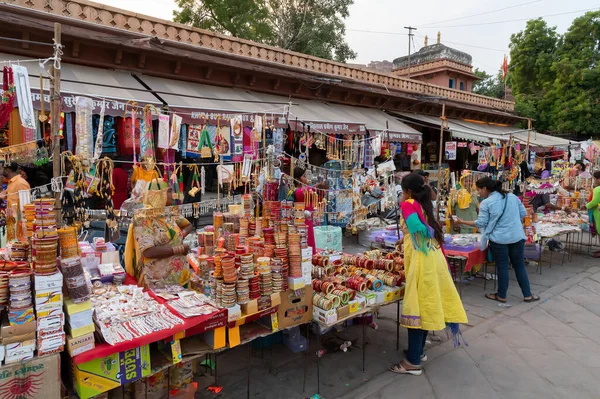 stock image Jodhpur, Rajasthan, India - 20.10.2019 : Beautiful Rajasthani Bangles being sold at famous Sardar Market and Ghanta ghar Clock tower in Jodhpur, Rajasthan, India.