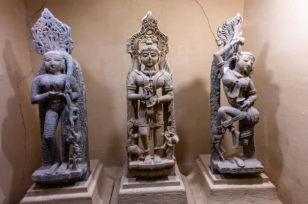 stock image Jaisalmer, Rajasthan, India - 15th October 2019 : Beautiful stone made antique sculptures of Hindu Gods and Goddesses inside museum of Rani Ka Mahal, Jaisalmer fort. Lady Radha with sokhi apsaras.